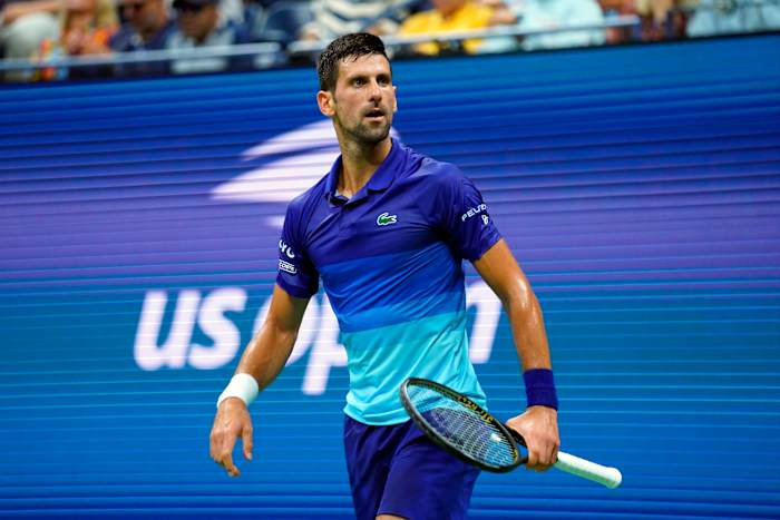 Novak Djokovic of Serbia looks to the crowd after winning a game at U.S. Open